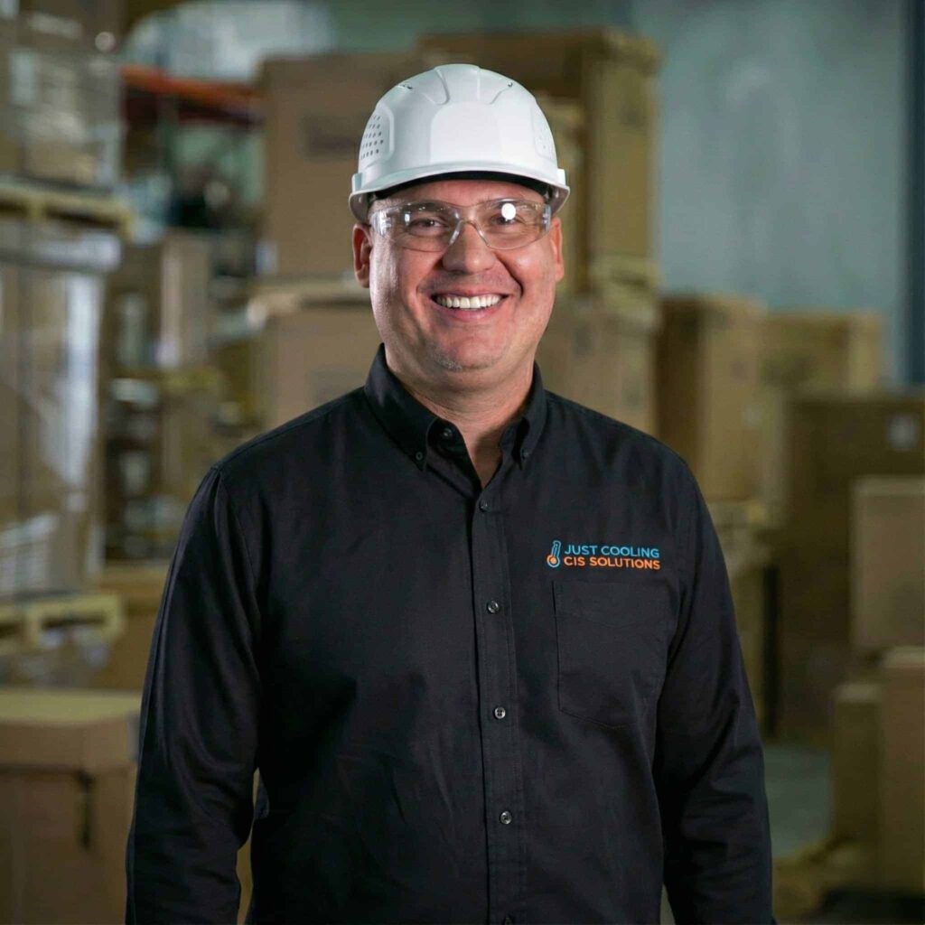 Just Cooling Air HVAC technician ready for DFW service on contact page.