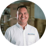 Professional Just Cooling Air HVAC technician in safety gear ready for service in Dallas Fort Worth.